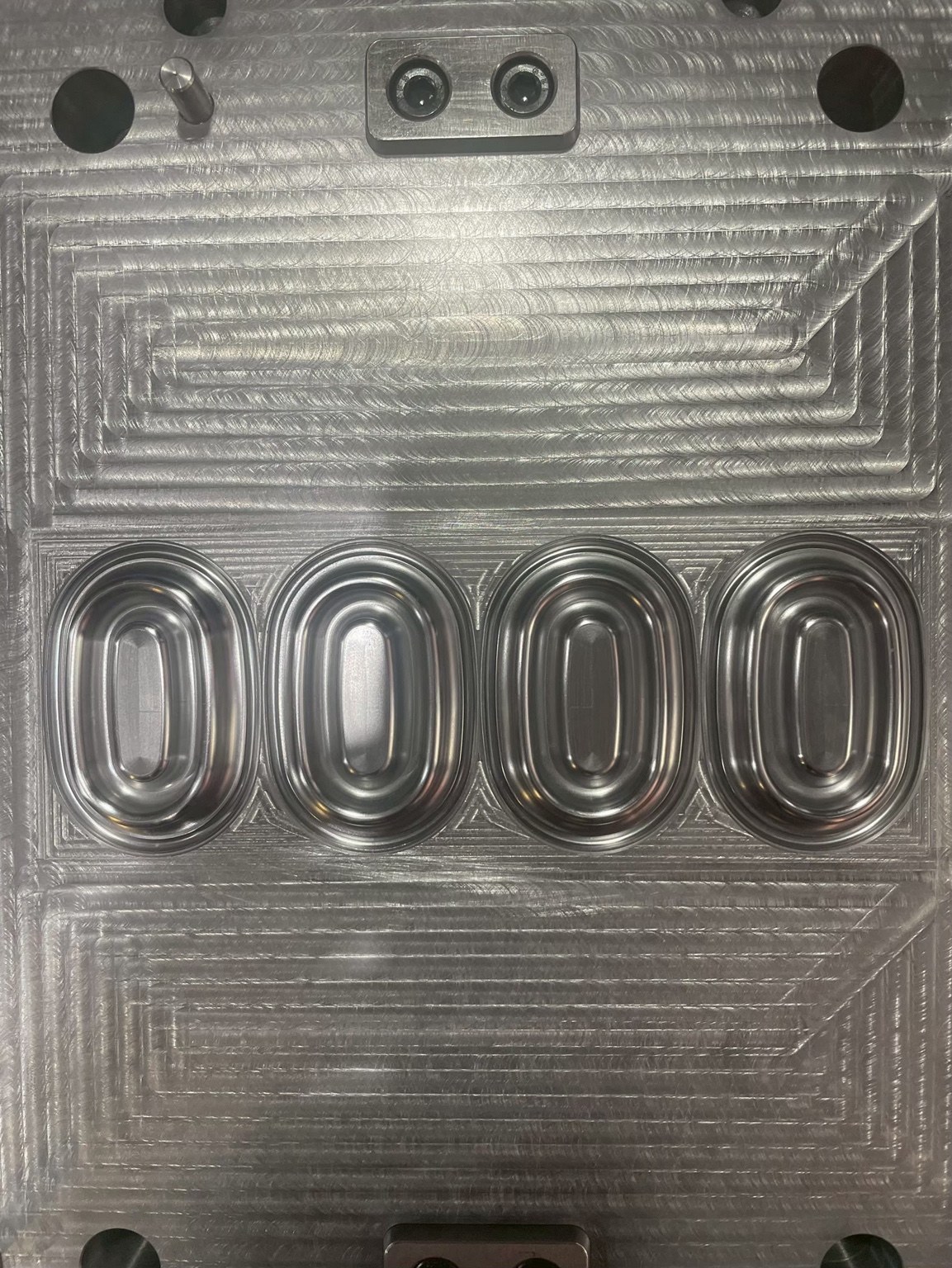 Four oval-profile cavities